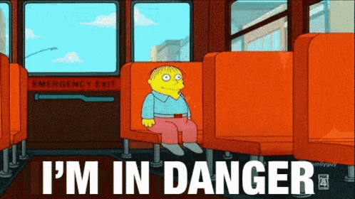 Animated reaction GIF: Ralph Wiggum sitting alone on a school bus with the caption "I'm in danger".