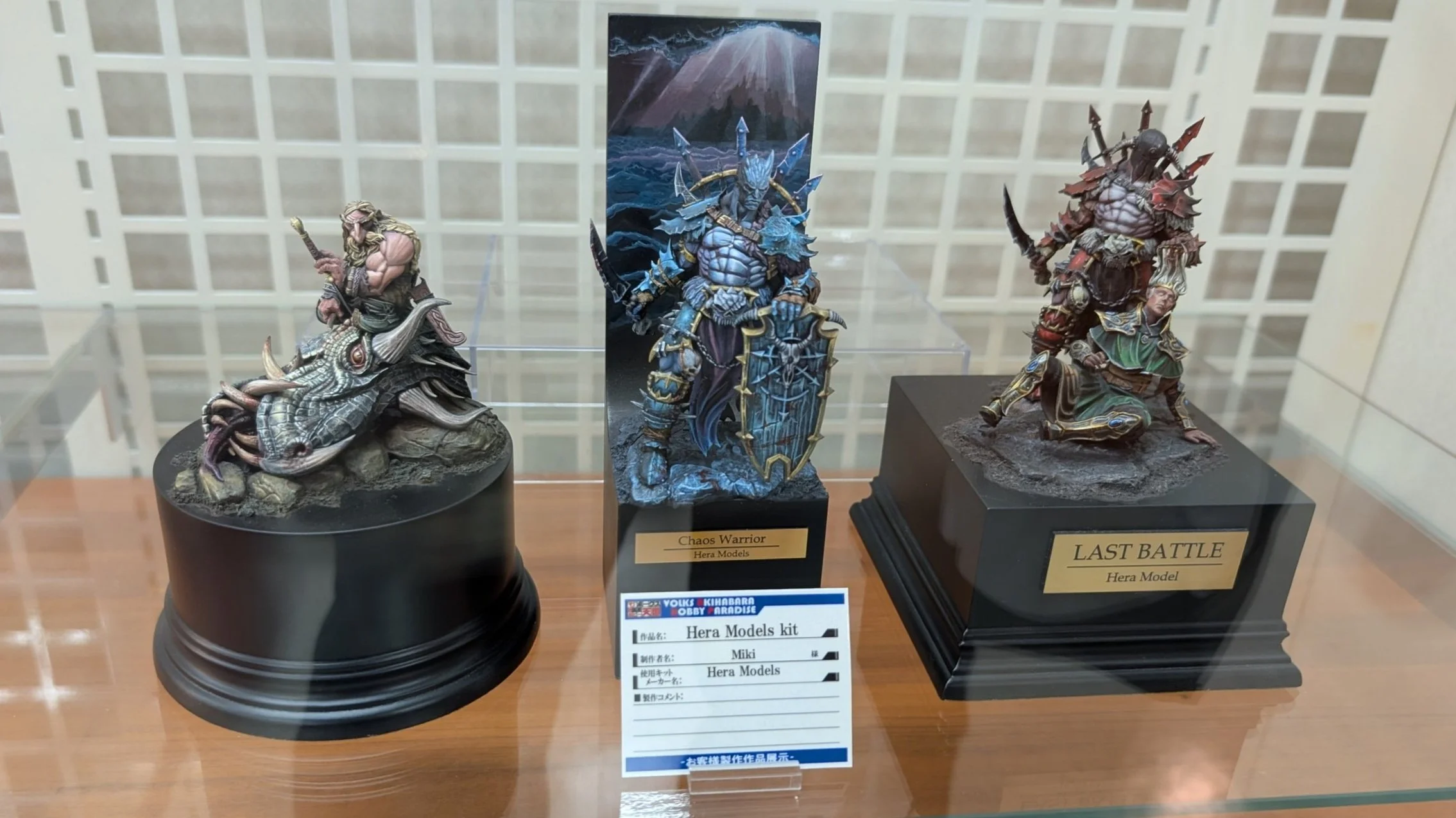 Model kits and miniatures on shelves in a Tokyo hobby shop.