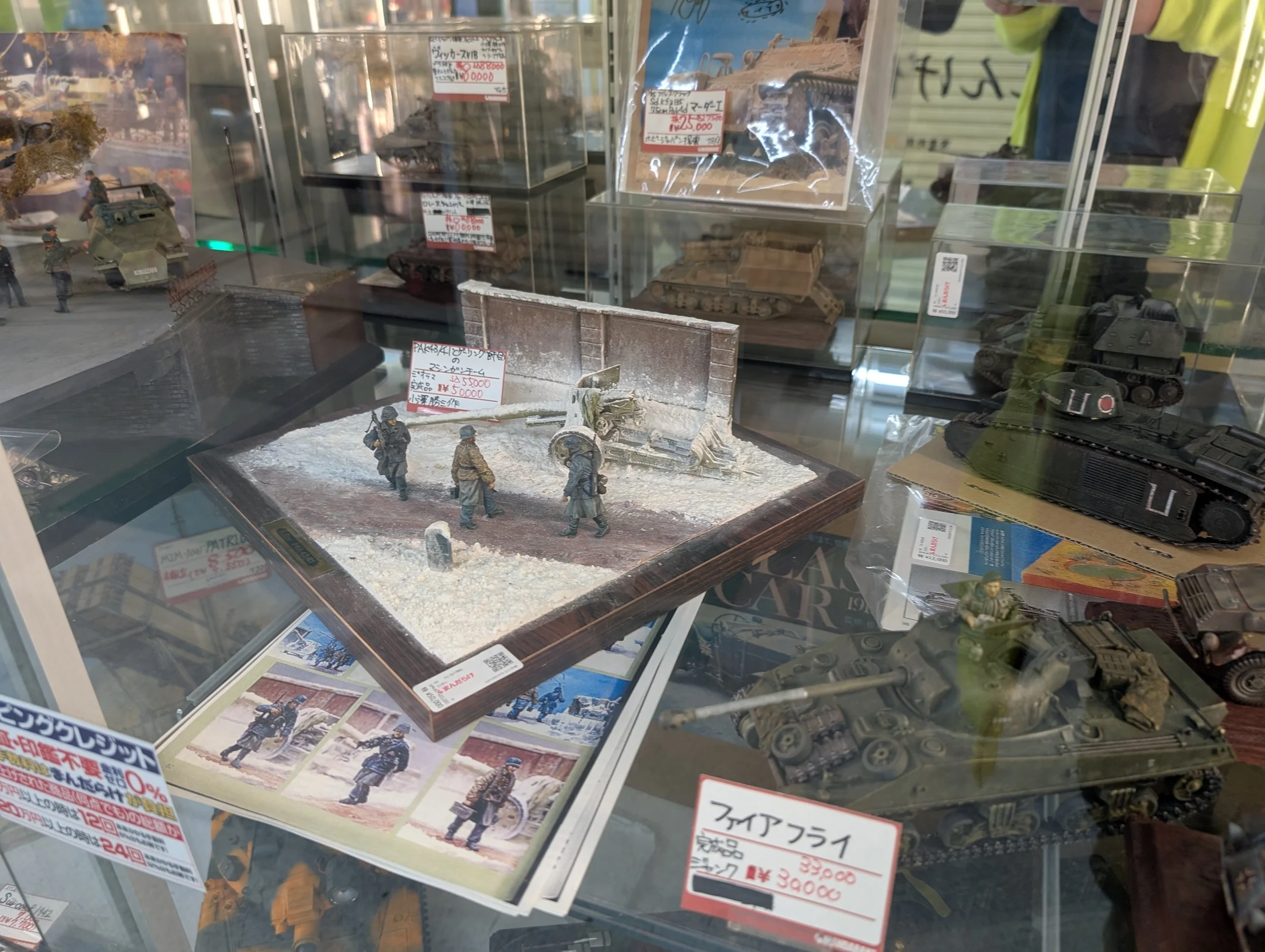 A store display of figures and model kits.
