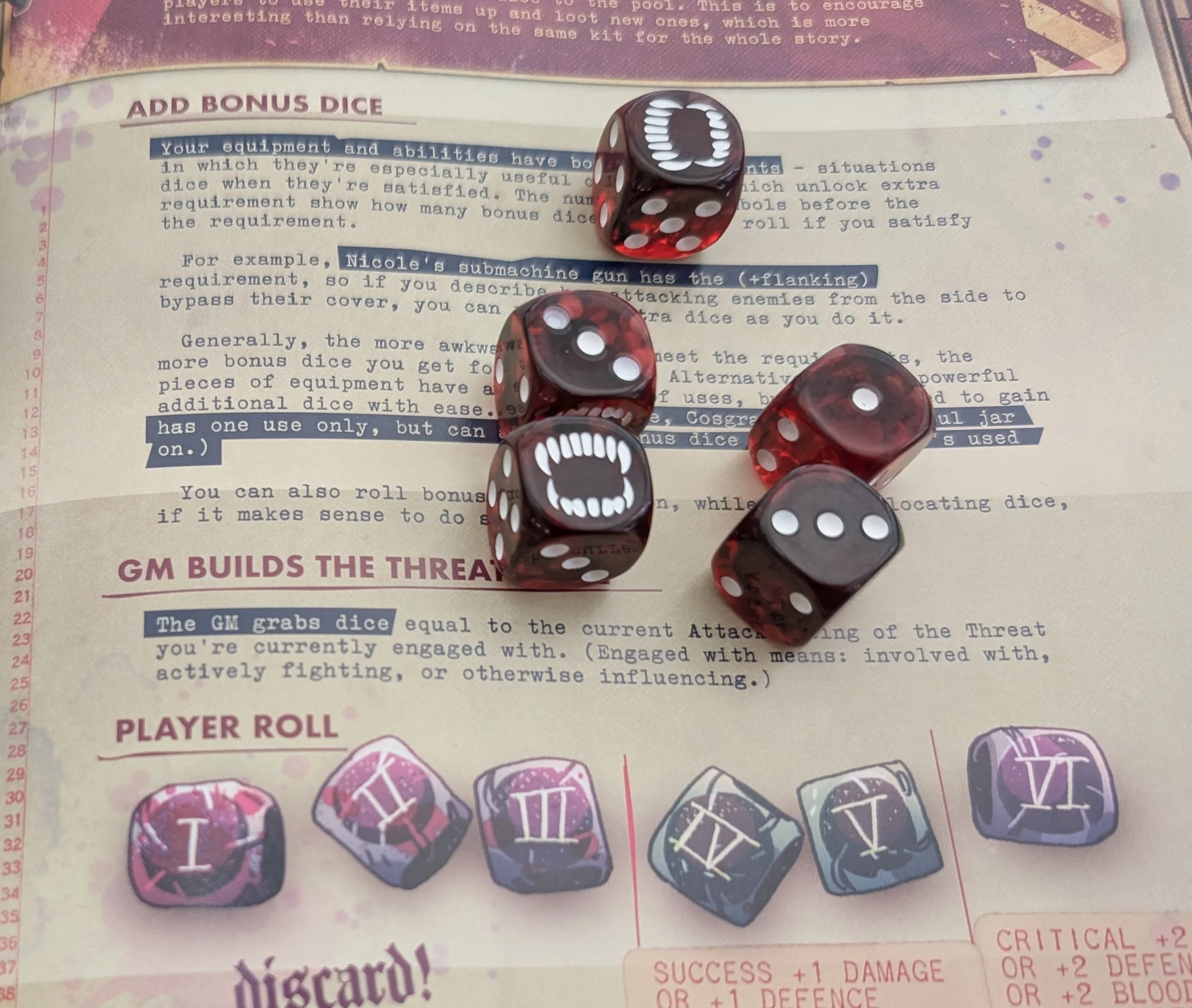 Five translucent blood-red dice, two showing fanged mouths in place of the six, resting on the open Eat the Reich rulebook.