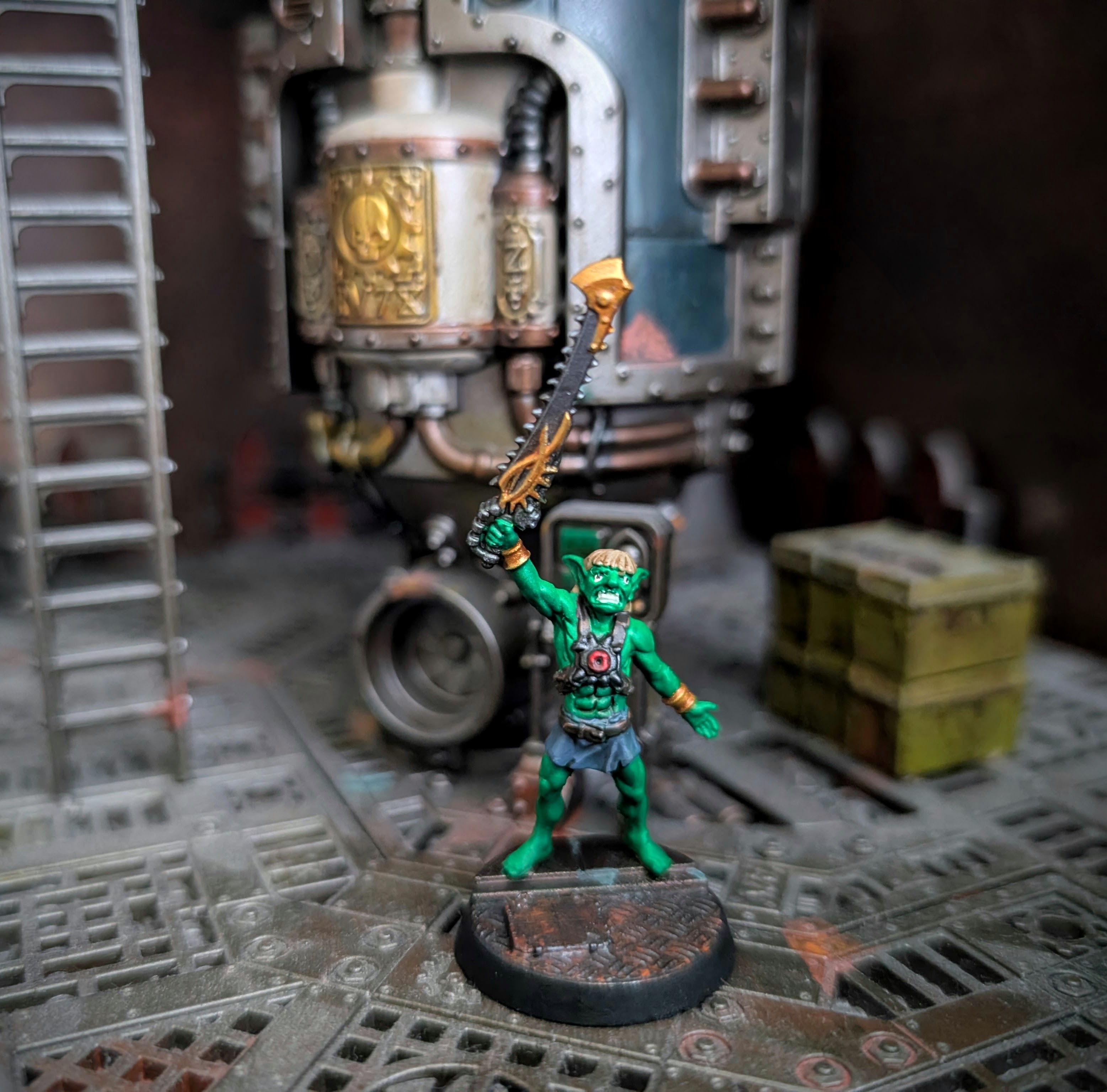 He-gob, one of the Masters of the Underhive, a goblin with a chain sword and blonde bowl cut