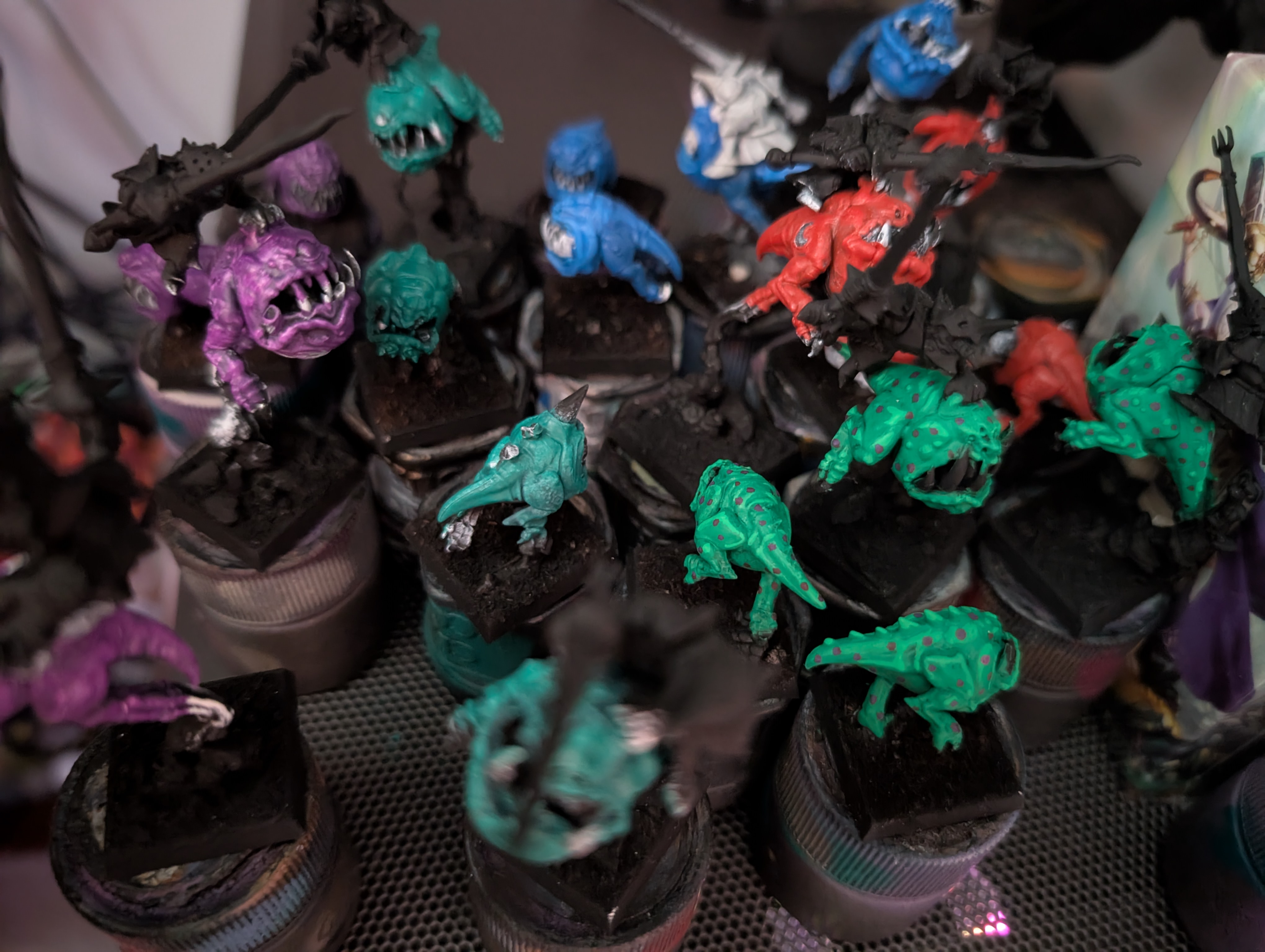 Squigs painted up in a rainbow of colors.